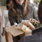 volunteer-handing-donation-box